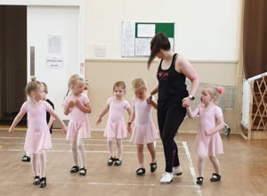 Rebecca Craig with tap dancing kids